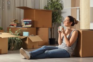 happy young lady tenant moving